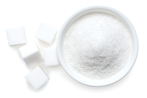 Bowl filled with white sugar cubes